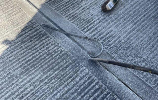 Mastic company cutting out mastic from floor joints