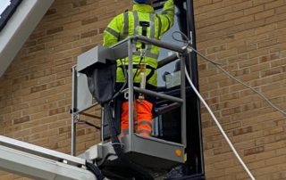 Mastic company with cherry picker servicing Trowbridge